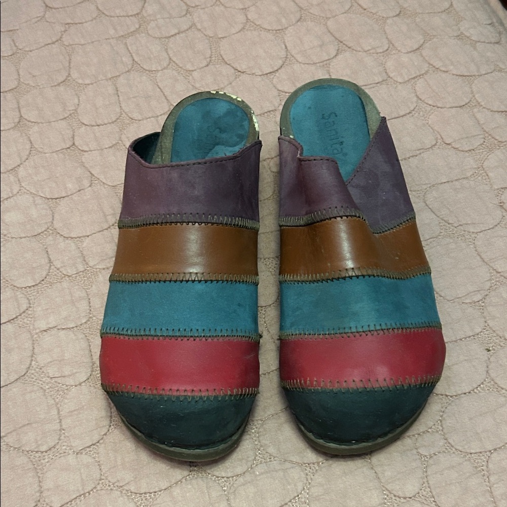 SANITA CLOGS 
Very unique 
Gently used
Noticeable flaw on right heel footbed.